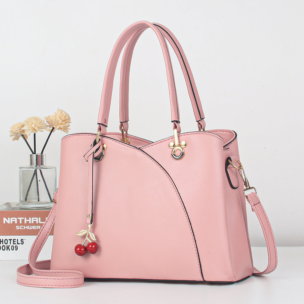 CARTERA DAMA | BOLSO DE MANO ROSADO CON DIJE CEREZAS